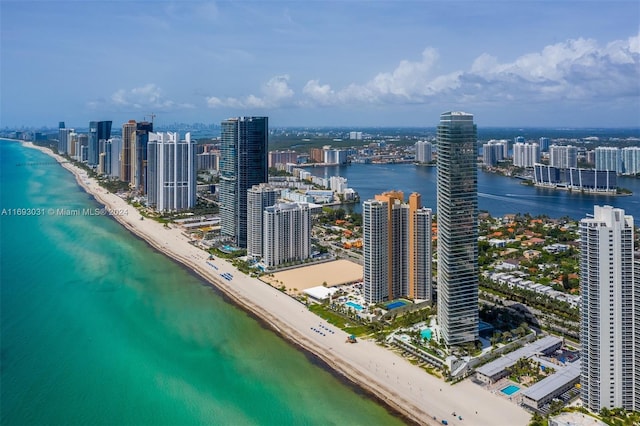 bird's eye view with a water view and a view of the beach