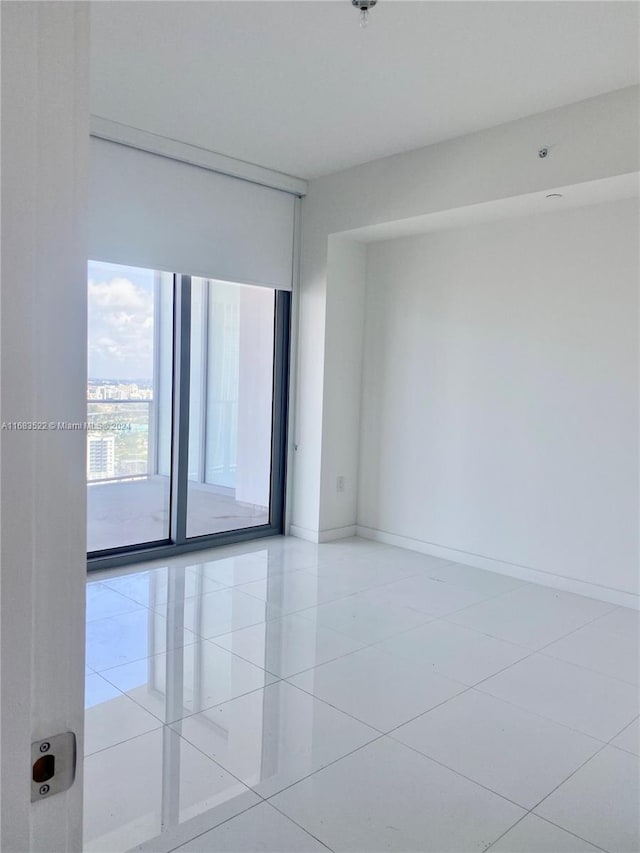 empty room with light tile patterned floors