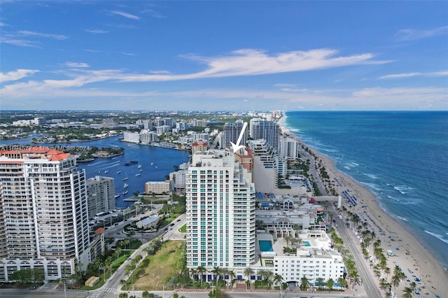 birds eye view of property featuring a view of the beach and a water view