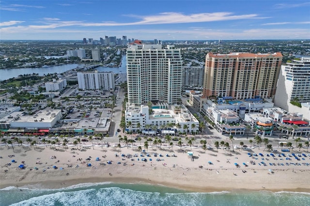 aerial view featuring a view of the beach and a water view