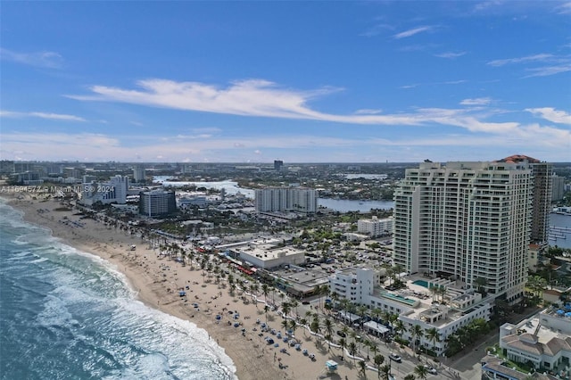 aerial view with a water view and a beach view