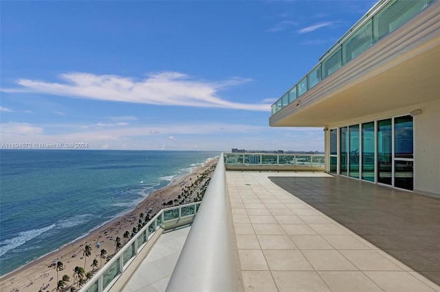 balcony with a view of the beach and a water view