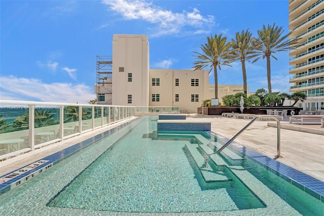 view of swimming pool featuring a patio area