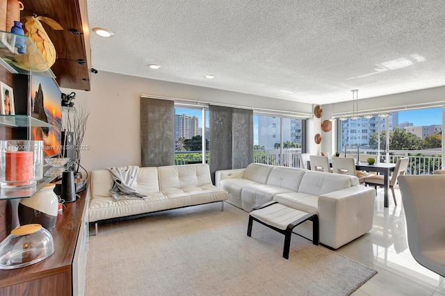 living room with light tile patterned floors and a textured ceiling