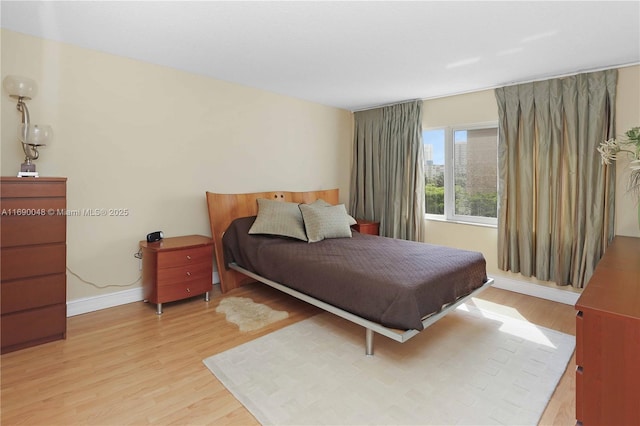 bedroom featuring light wood-type flooring