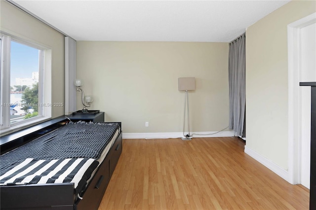 bedroom with light hardwood / wood-style flooring