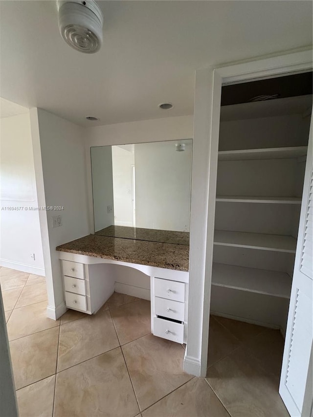 bathroom with tile patterned flooring