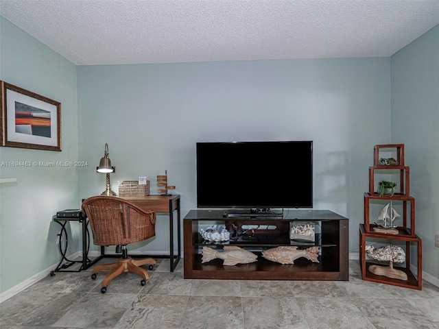 office area with a textured ceiling