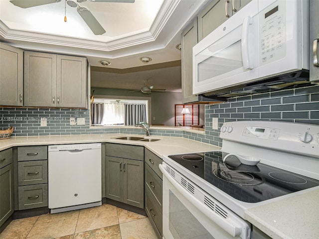 kitchen featuring decorative backsplash, white appliances, sink, and ornamental molding