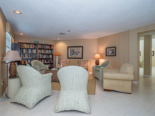 living room with a textured ceiling