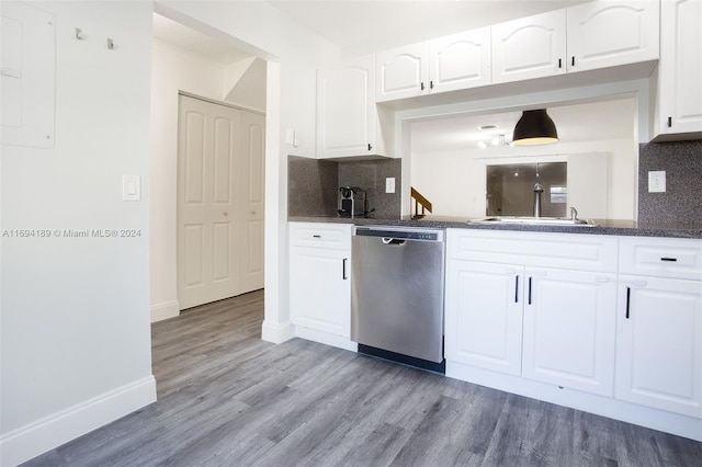 kitchen with backsplash, white cabinetry, dishwasher, and light hardwood / wood-style flooring