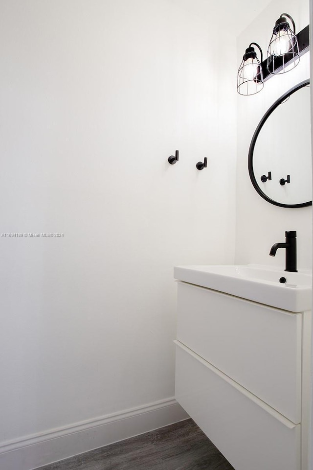 bathroom featuring wood-type flooring