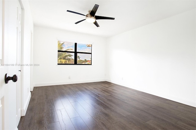 unfurnished room with ceiling fan and dark hardwood / wood-style flooring