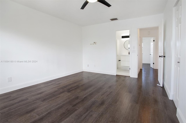 spare room with dark hardwood / wood-style floors and ceiling fan