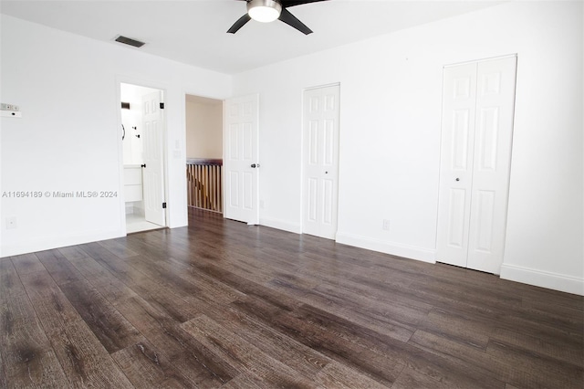 unfurnished room featuring dark hardwood / wood-style floors and ceiling fan