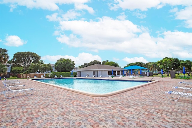 view of swimming pool with a patio area