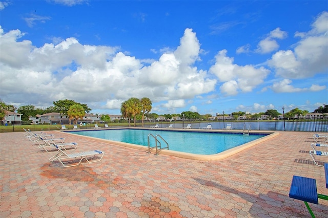 view of swimming pool with a patio