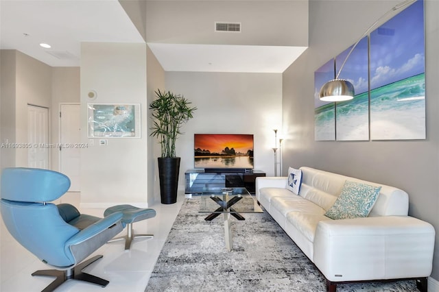 living room with tile patterned flooring