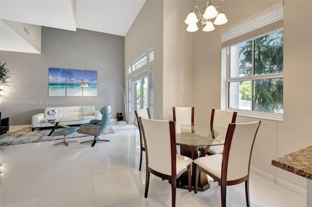 dining room with light tile patterned floors and an inviting chandelier