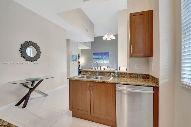 350 N Federal Hwy Unit 104S, Boynton Beach, FL 33435 - kitchen with stainless steel appliances, light tile patterned floors, light stone counters, and brown cabinetry