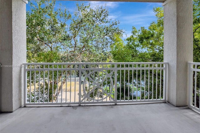 350 N Federal Hwy Unit 104S, Boynton Beach, FL 33435 - laundry room featuring stacked washer and clothes dryer and wood finished floors