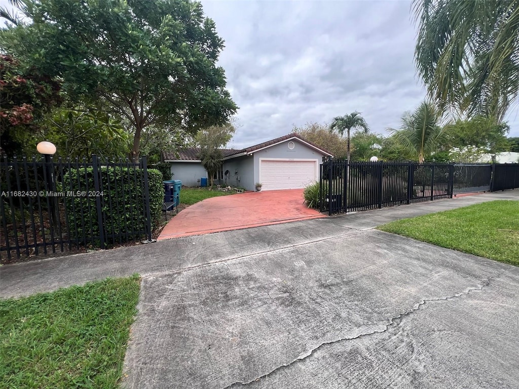 view of front facade with a front lawn and a garage