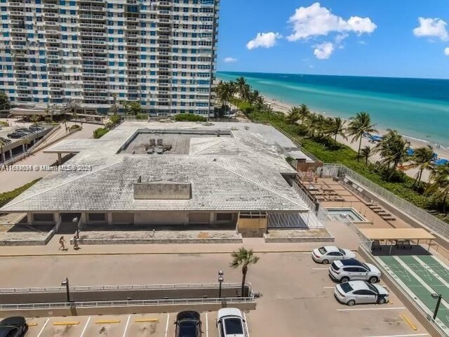 bird's eye view with a view of the beach and a water view