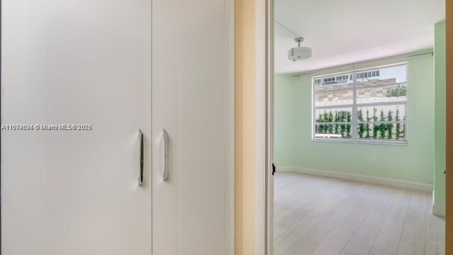 corridor featuring light hardwood / wood-style flooring