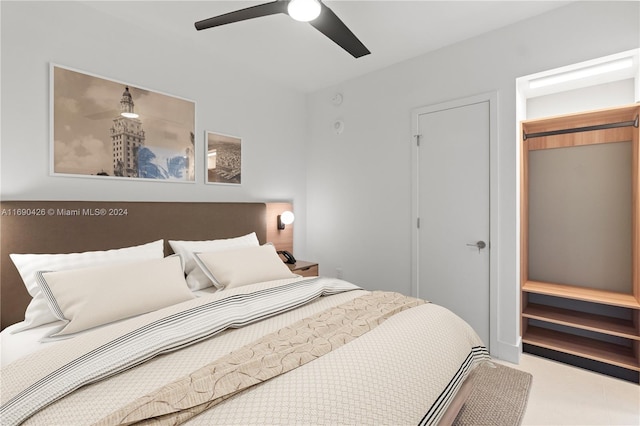 carpeted bedroom featuring ceiling fan and a closet