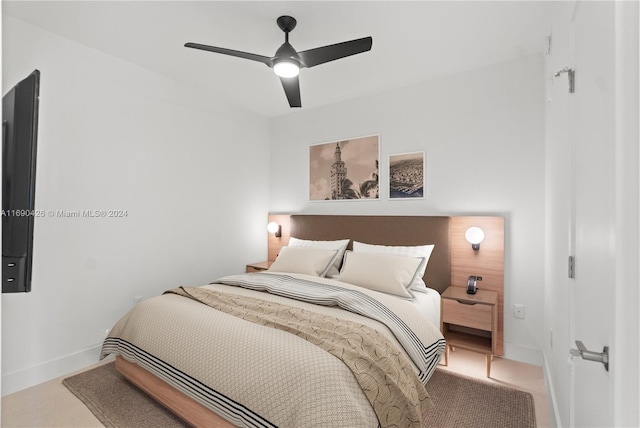 bedroom featuring ceiling fan and carpet