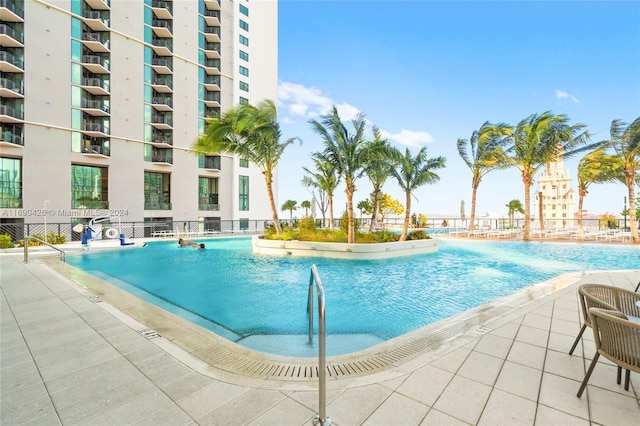 view of swimming pool featuring a patio