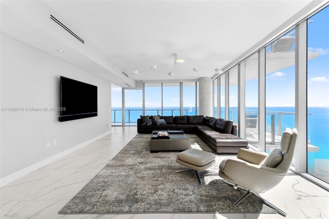 living room featuring plenty of natural light and expansive windows