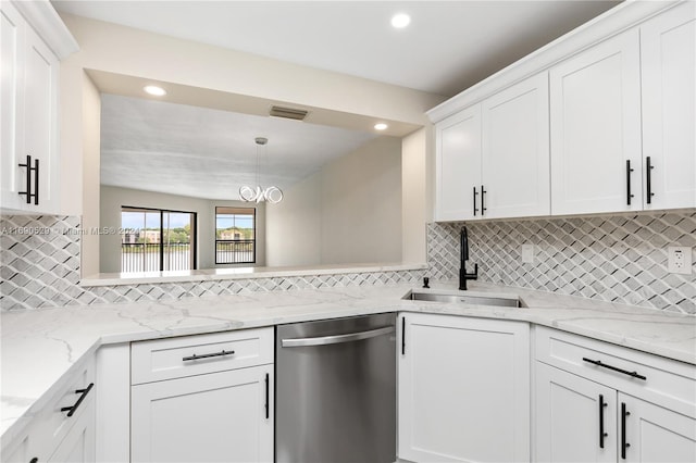 kitchen with white cabinets, sink, stainless steel dishwasher, decorative backsplash, and decorative light fixtures