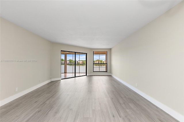 spare room with light wood-type flooring