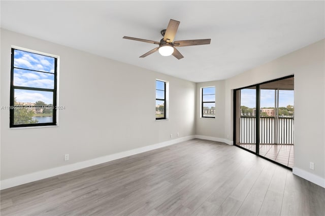 unfurnished room with light hardwood / wood-style floors and ceiling fan