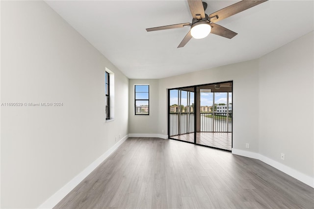 empty room featuring ceiling fan and light wood-type flooring