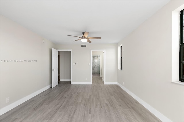 spare room featuring light hardwood / wood-style floors and ceiling fan