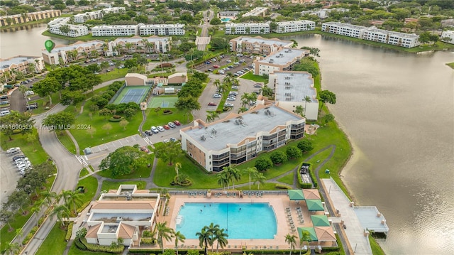 birds eye view of property with a water view