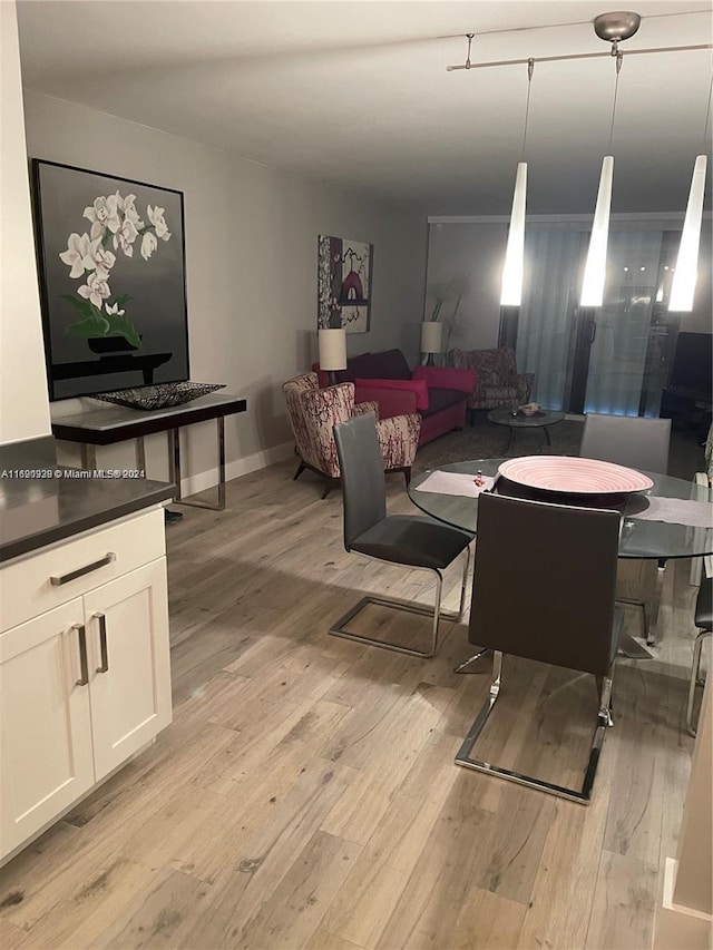 dining space featuring light hardwood / wood-style floors