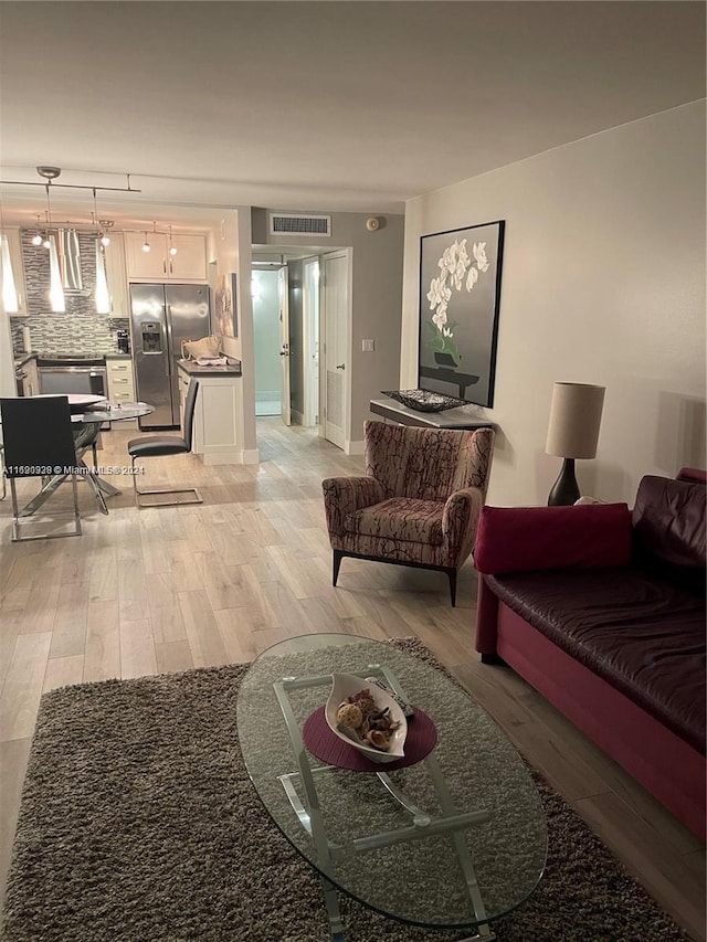 living room with light hardwood / wood-style floors