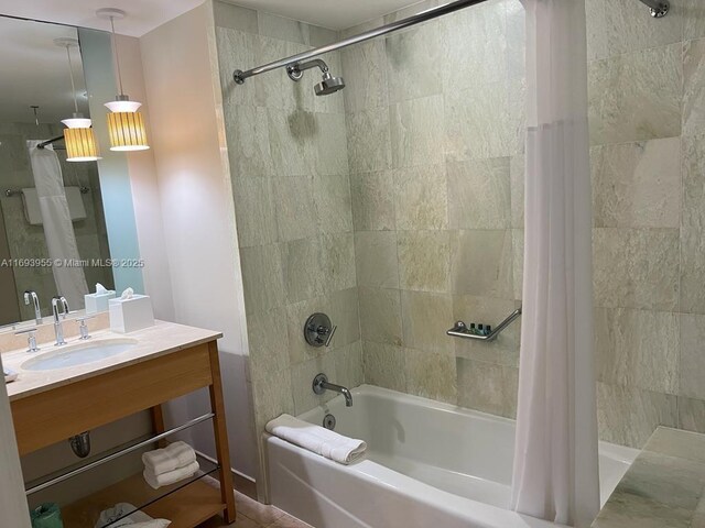 bathroom with shower / bath combination with curtain and vanity