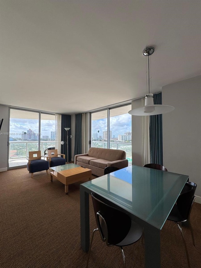 dining space featuring floor to ceiling windows, carpet floors, and a wealth of natural light