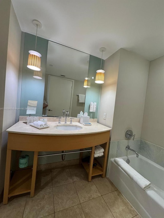 bathroom with sink, tile patterned floors, and a bathing tub