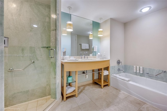 bathroom with tile patterned flooring, vanity, and separate shower and tub