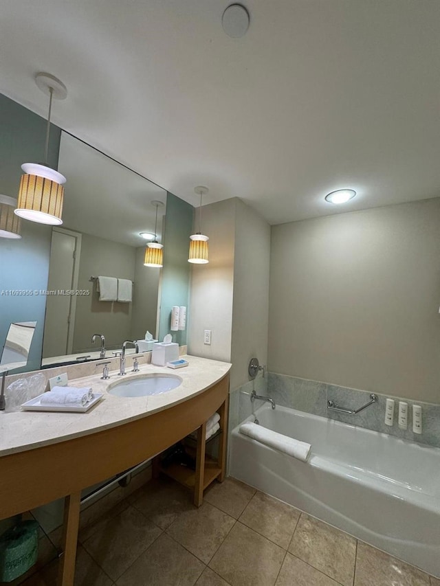 bathroom featuring sink, a bath, and tile patterned floors