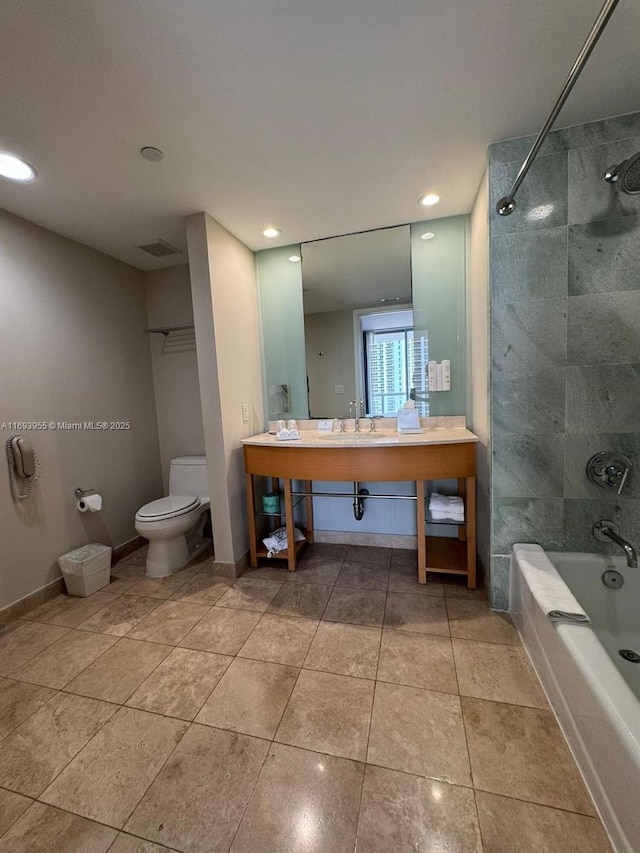 full bathroom featuring tile patterned flooring, sink, toilet, and tiled shower / bath