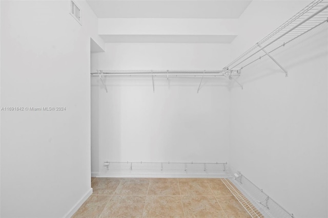 walk in closet featuring light tile patterned floors