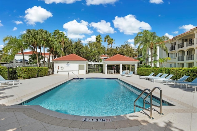 view of swimming pool with a gazebo and a patio