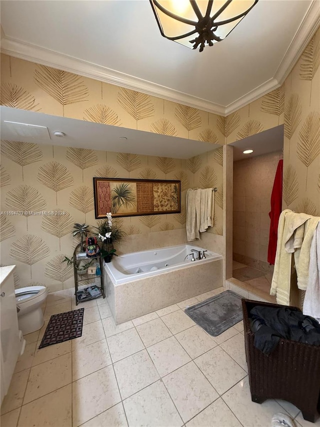 bathroom featuring tile patterned floors, a relaxing tiled tub, toilet, and crown molding