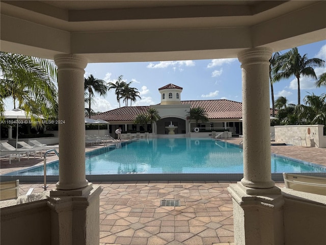 view of swimming pool featuring a patio